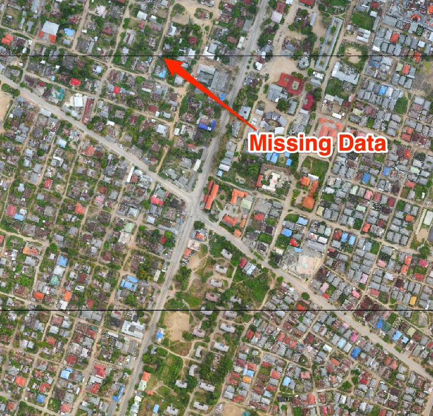 Source Image: © Commission for Lands (COLA) ; Revolutionary Government of Zanzibar (RGoZ), Downloaded from OpenAerialMap. (Note: The data gap is simulated using a python script and is not part of the original dataset)